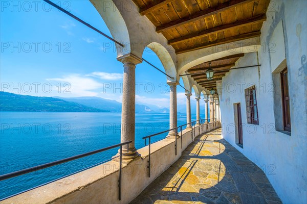 Archs in Eremo di Santa Caterina del Sasso and Lake Maggiore with mountain in Leggiuno in Lombardy