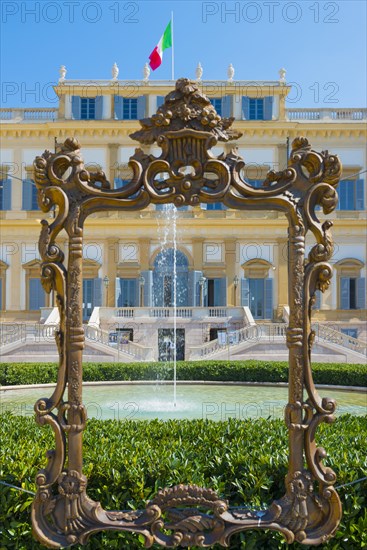 Frame and Fountain In Front of the Royal Villa of Monza with Italian Flag in a Sunny Day in Lombardy in Italy