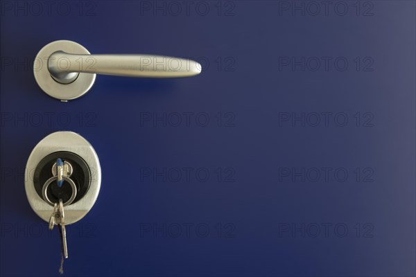 Door handle on a blue door