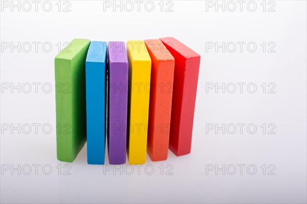 Colorful Domino Blocks in a line on a white background