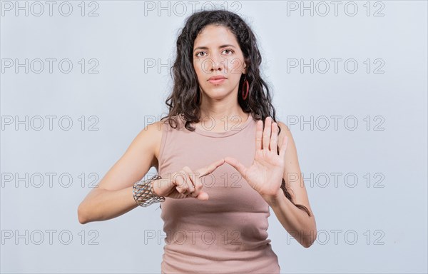 Lating girl gesturing in sign language isolated. Young woman gesturing in sign language