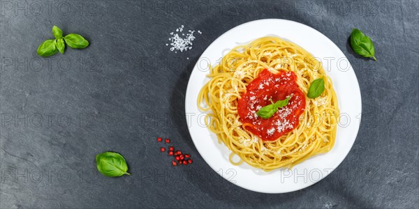 Spaghetti eating Italian pasta lunch dish with tomato sauce from above panorama on slate in Stuttgart