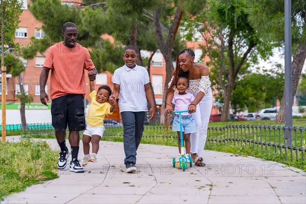 African black ethnicity family with children on playground