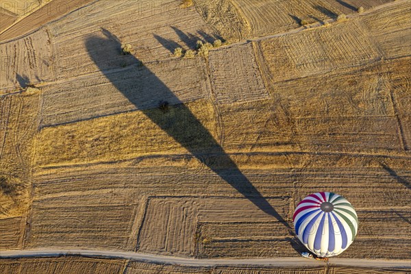 Hot air balloon over fields