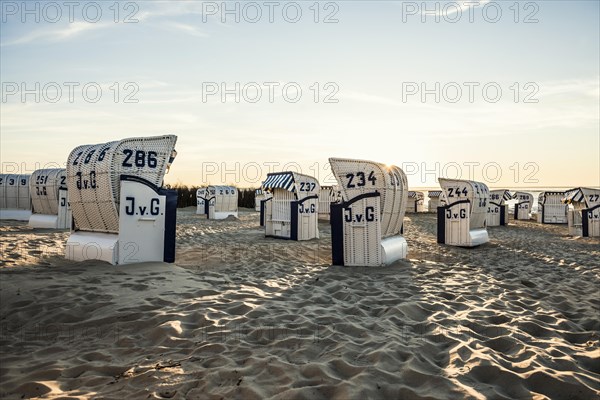 White beach chairs and mudflats