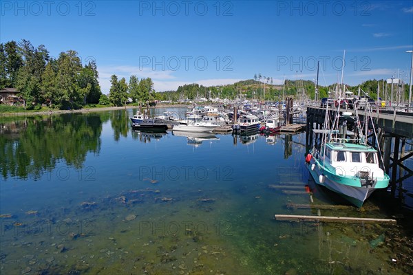 Small fishing boats in calm crystal clear water