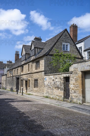 Merton Street with cobblestones and historic houses in the old town of Oxford