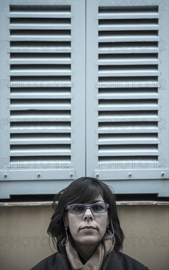 Woman Under a Window with Shutter