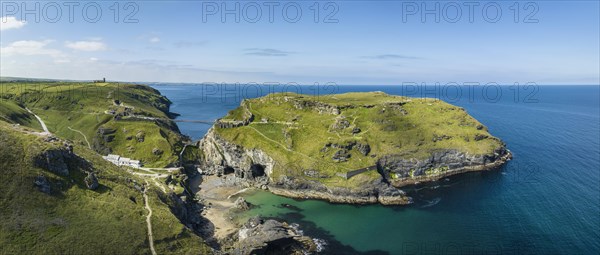 Aerial panorama of the rugged coastline on the Celtic Sea with the Tintagel Peninsula and the ruins of Tintagel Castle