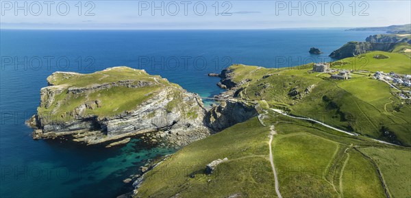 Aerial panorama of the rugged coastline on the Celtic Sea with the Tintagel Peninsula and the ruins of Tintagel Castle