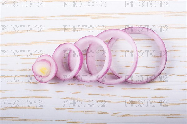 Sliced onion rings and onion slices on the background