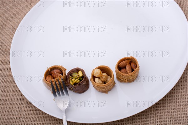 Nut stuffed dessert of mini size cuisine on a plate