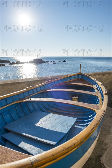 Old Boat on the Beach on Mediterranean Sea and sunlight in Boccadasse in Genoa