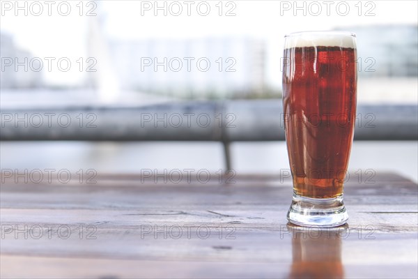 Glass of beer on blurred background