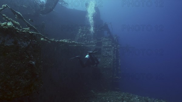 Scuba diver swim along hull of ferry Salem Express shipwreck