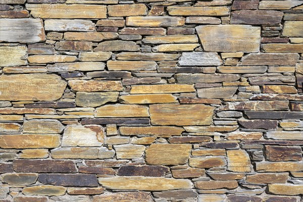 Slate slabs stacked to form a wall