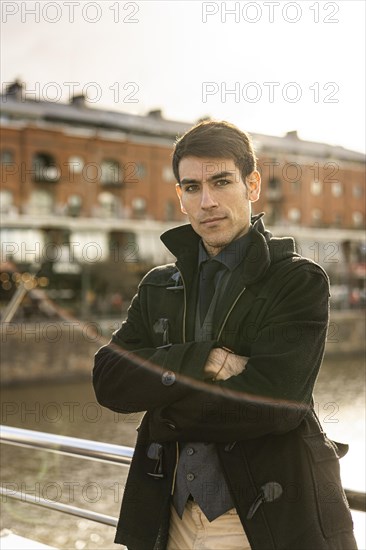 Portrait of an attractive male tourist looking at camera in Puerto Madero