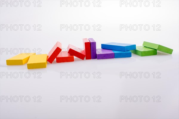 Colorful Domino Blocks in a line on a white background
