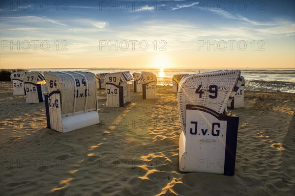 White beach chairs and mudflats