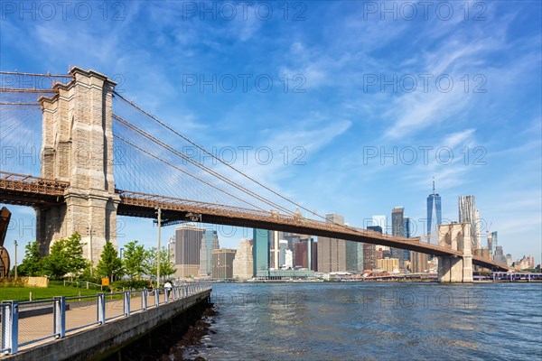 Brooklyn Bridge in New York City Manhattan skyline with World Trade Center skyscraper in New York