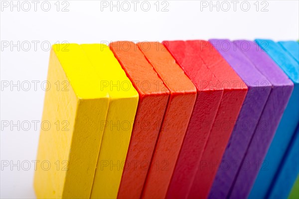 Colorful Domino Blocks in a line on a white background