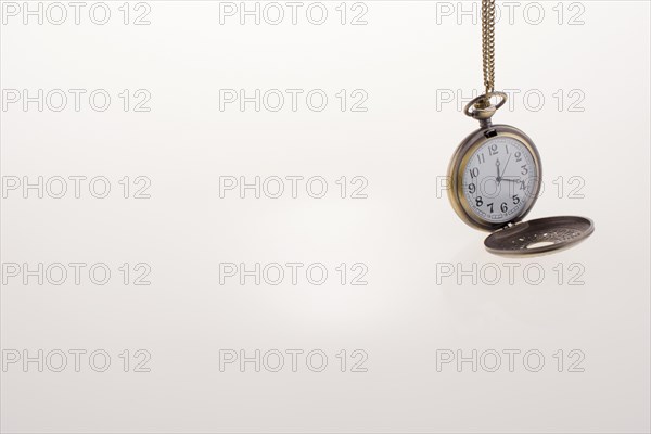 Isolated retro styled pocket watch on white background