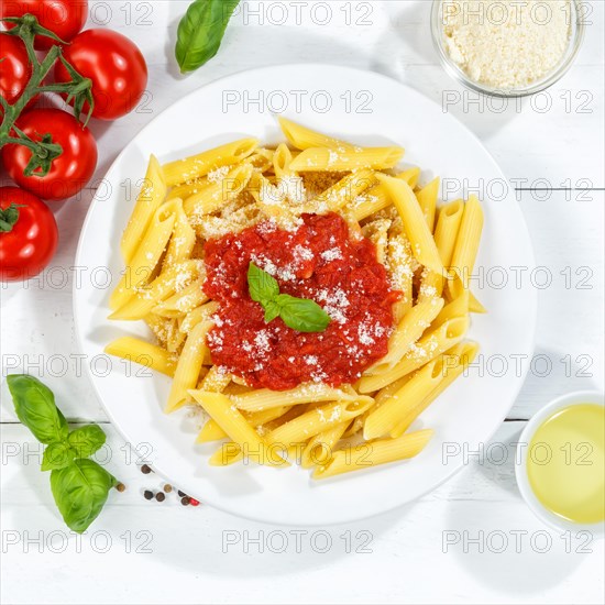 Penne Rigatoni Rigate Italian pasta in tomato sauce eat lunch dish on plate from above square in Stuttgart