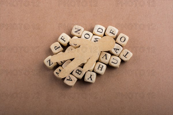 Paper man and letter cubes of made of wood