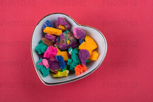 Dry colorful play dough in smal pieces