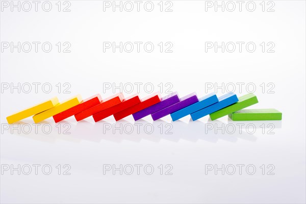 Colorful Domino Blocks in a line on a white background