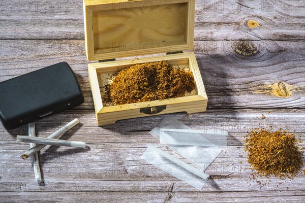 Wooden box with rolling tobacco