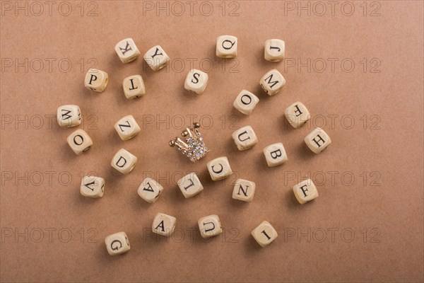 Letter cubes of Alphabet made of wood around crown