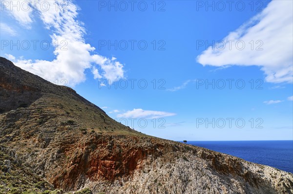 Beautiful wild red cliffs against clear blue sky