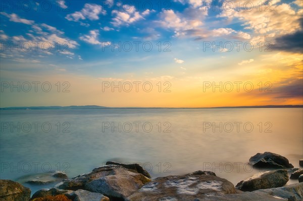 Atmospheric clouds at sunrise on Lake Constance