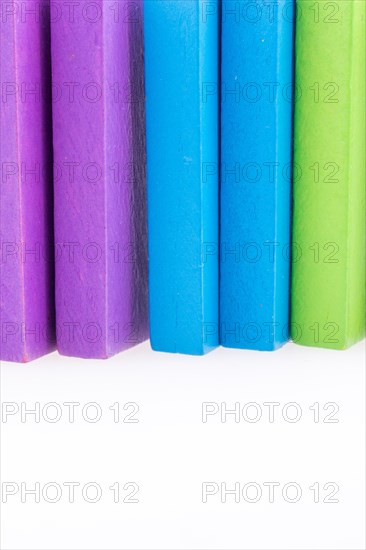 Colorful Domino Blocks in a line on a white background