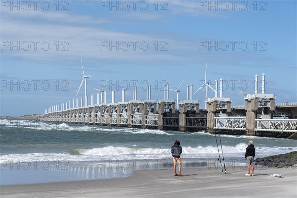 Anglers on Banjaard beach in front of the Oosterschelde barrage