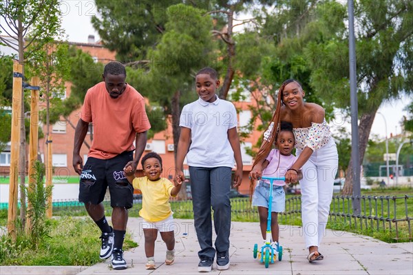 African black ethnicity family with children on playground