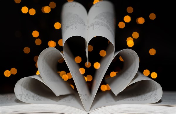 Three Hearts form a Book with Light Effect