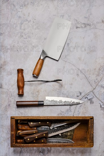 Vertical composition with used butcher tools