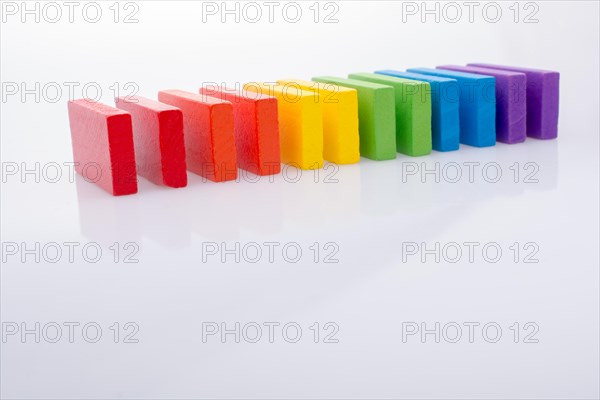 Colorful Domino Blocks in a line on a white background