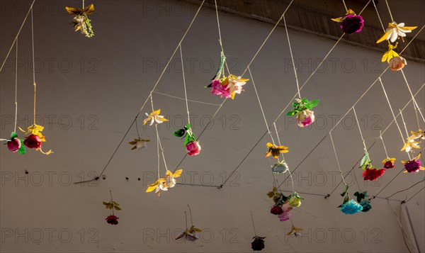 Floral art made of colorful artificial flowers as street decoration