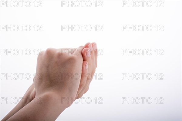 Closed Hand holding on a white background
