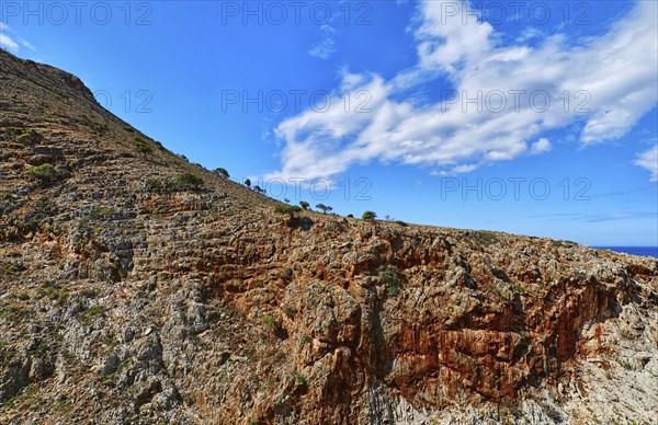 Beautiful wild red cliffs against clear blue sky