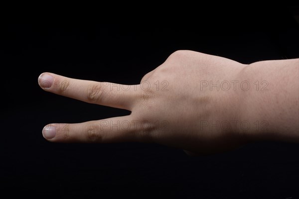 The sign of victory and peace in black background