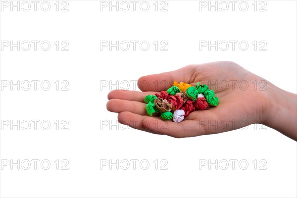 Handful crumpled colorful paper on a white background