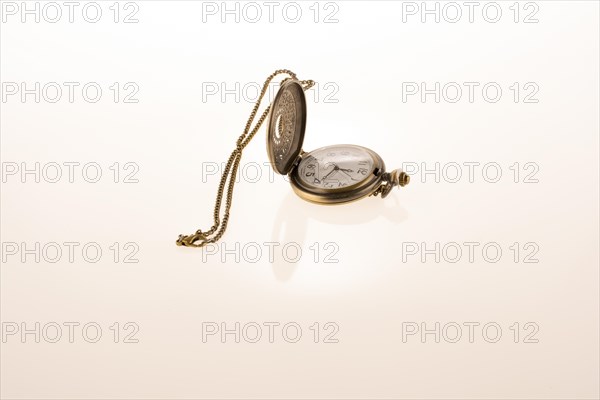 Isolated retro styled pocket watch on white background