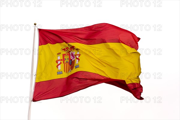 Flag of spain waving in the wind with white background and copy space