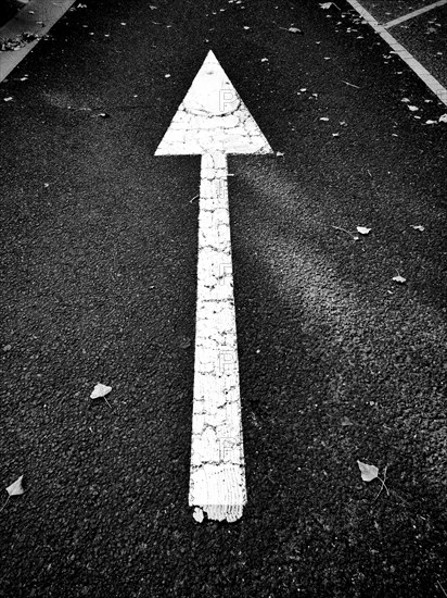 Direction arrow on macadam