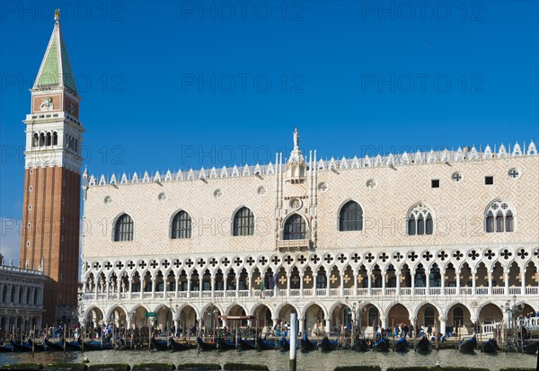 Doge's Palace with Bell Tower and Gondola in St. Mark's Square in a Sunny Day in Venice
