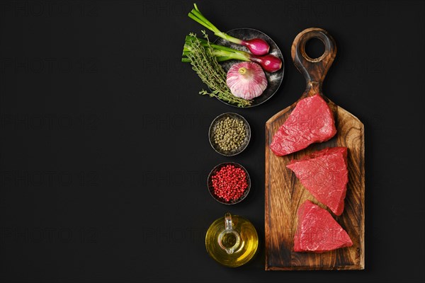 Top view of coulotte roast beefsteak on wooden cutting board